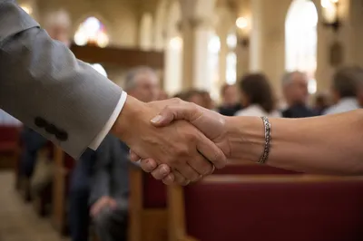 Warm Church Welcome Handshake in Sanctuary