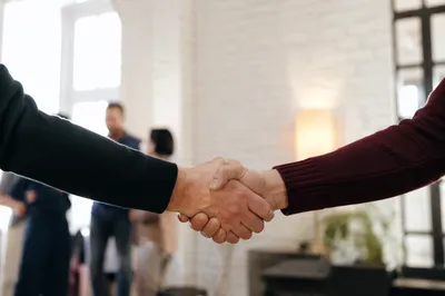 Warm Church Welcome Handshake in Foyer