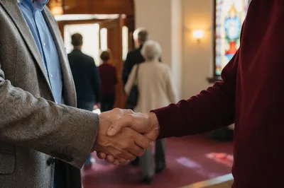 Warm Church Welcome Handshake in Foyer