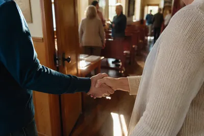 Warm Church Welcome Handshake at Chapel Door