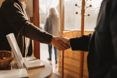 Warm Church Welcome Handshake at Chapel Doorway