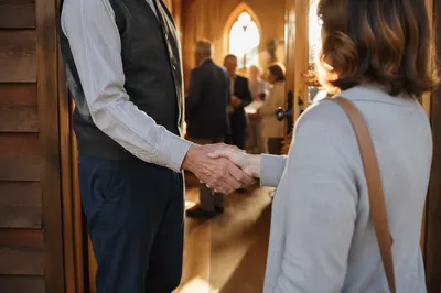 Warm Church Welcome Handshake at Chapel Doorway