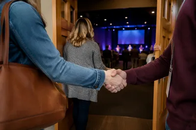 Warm Church Welcome Handshake at Auditorium Doors
