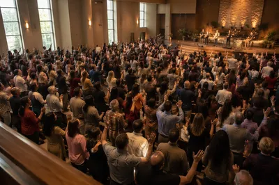Raised Hands in Church Sanctuary