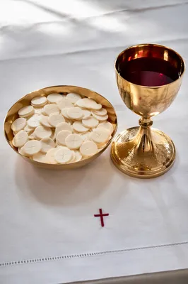 Communion Table with Bread and Gold Chalice