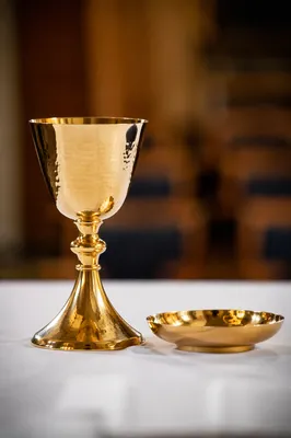 Gold Chalice and Paten on Communion Table