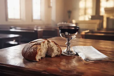 Reverent Communion Table with Bread and Chalice