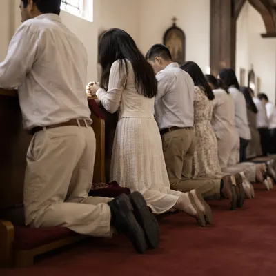 Congregation Kneeling at Communion Rail in Worship