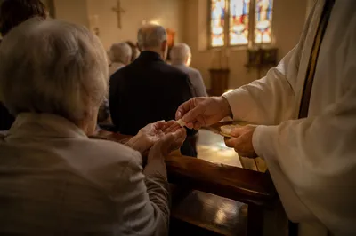 Congregation Kneeling at Communion Rail