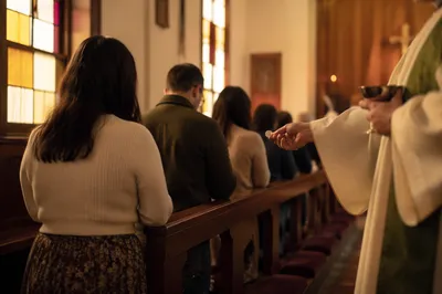 Congregation Kneeling for Communion in Chapel