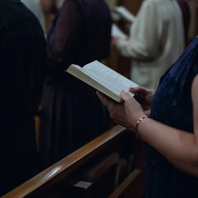 Congregants Singing from Hymnals in Sanctuary