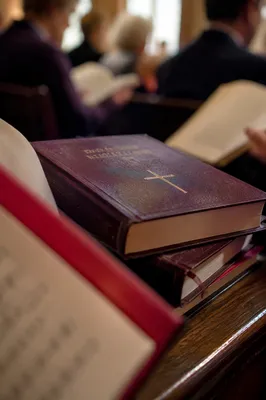 Hymn Books on Wooden Church Pew