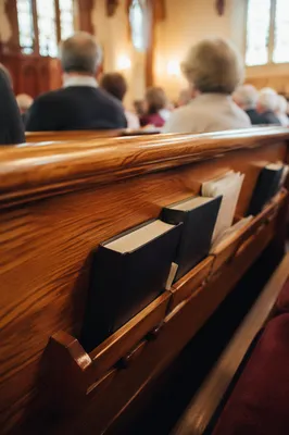 Congregation Singing with Hymnals in Church Pew