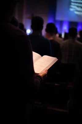 Congregation Singing Hymns in Dim Sanctuary