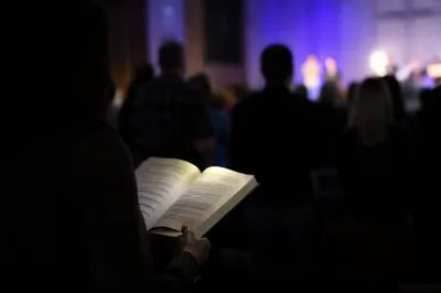 Congregation Singing From Hymnals in Worship