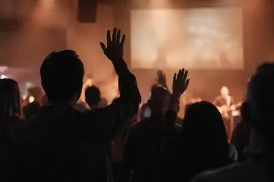 Raised Hands in Contemporary Worship Auditorium