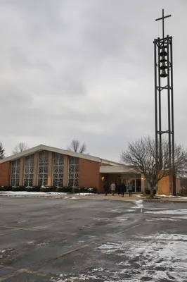 Diverse Worshippers Outside Urban Winter Church