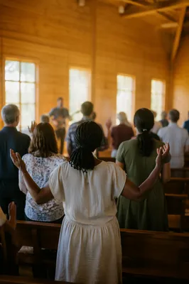 Diverse Congregation Worshiping in Sunlit Sanctuary
