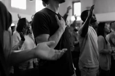 Diverse Congregation Worshiping in Modern Sanctuary