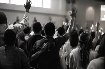 Diverse Congregation Worshiping in Modern Church
