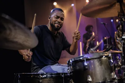 Young Drummer Performing on Church Stage