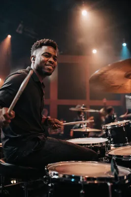 Young Drummer Performing in Church Auditorium