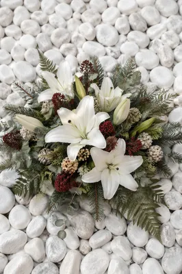 White Lily Sympathy Arrangement on Pebbles
