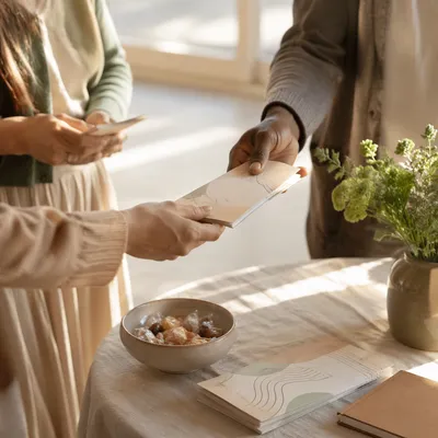Hands Sharing Gospel Pamphlets at Church