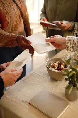 Welcoming Hands Sharing Gospel Pamphlets