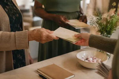 Welcoming Hands Sharing Gospel Pamphlets