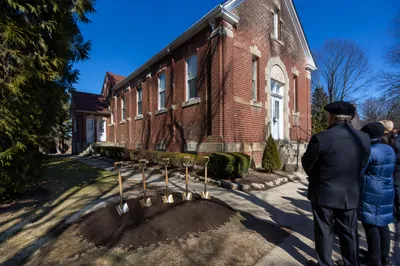 Church Groundbreaking Ceremony by Brick Building