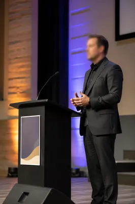 Guest Speaker at Church Conference Podium