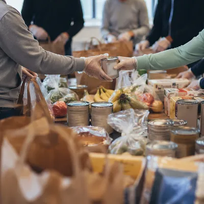 Church Volunteers Sharing Food Outreach Supplies