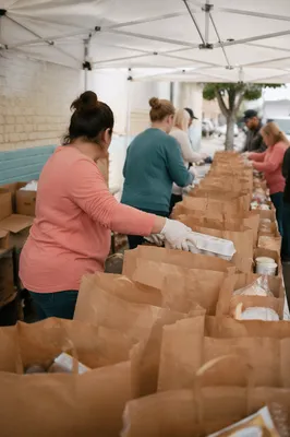 Church Volunteers Preparing Food Outreach Bags