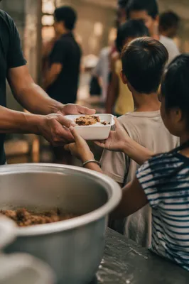 Hands Sharing Meals in Church Outreach