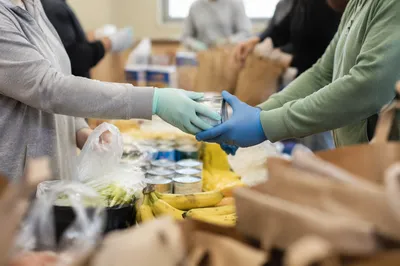 Church Food Outreach Volunteers Sharing Groceries
