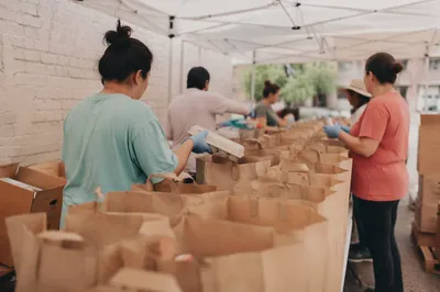 Church Volunteers Packing Food Outreach Bags
