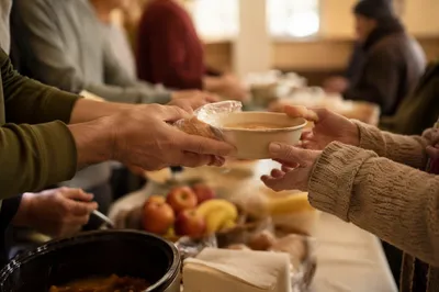 Volunteers Sharing Meals at Church Outreach
