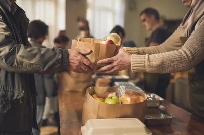 Outreach Ministry Hands Sharing Food