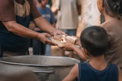 Hands Serving Meals in Outreach Ministry