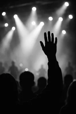 Raised Hand in Worship Concert Lights