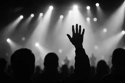 Raised Hand Worship in Concert Lights