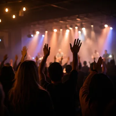 Raised Hands in Contemporary Worship Lights