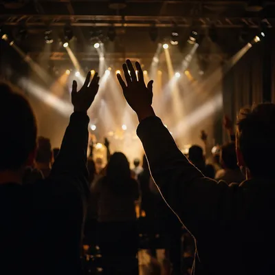 Raised Hands in Worship Concert Lights