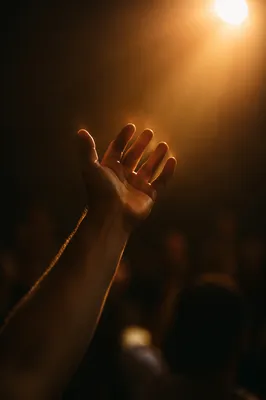 Raised Hand in Worship Spotlight