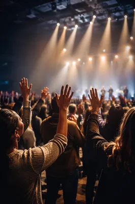Raised Hands in Church Auditorium