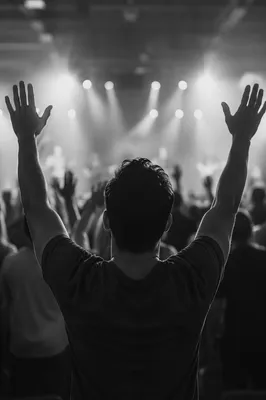 Raised Hands in Worship Concert Lights
