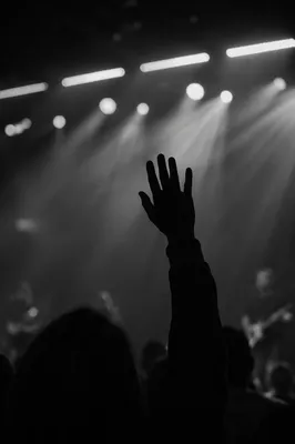 Raised Hand in Worship Concert Lights