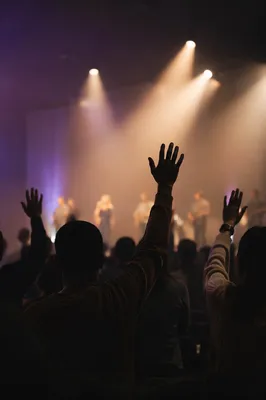 Raised Hands in Worship Light