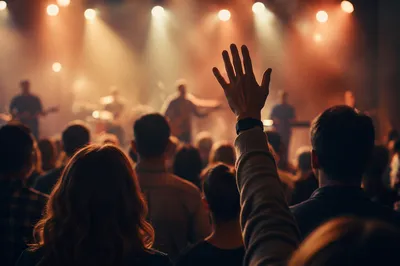 Raised Hands in Worship Concert Lights